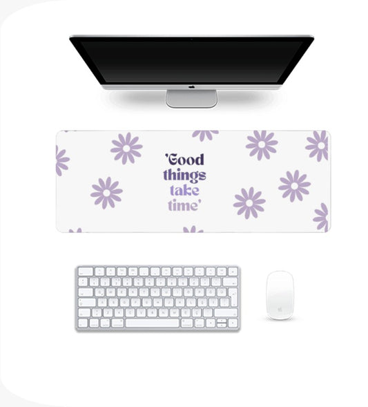 White desk setup with a computer monitor, keyboard, Gaming Pad