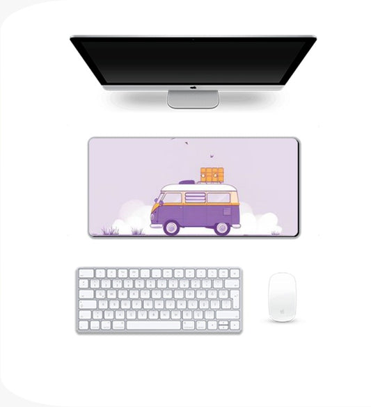Computer setup with a desk mat featuring a van design Gaming Pad